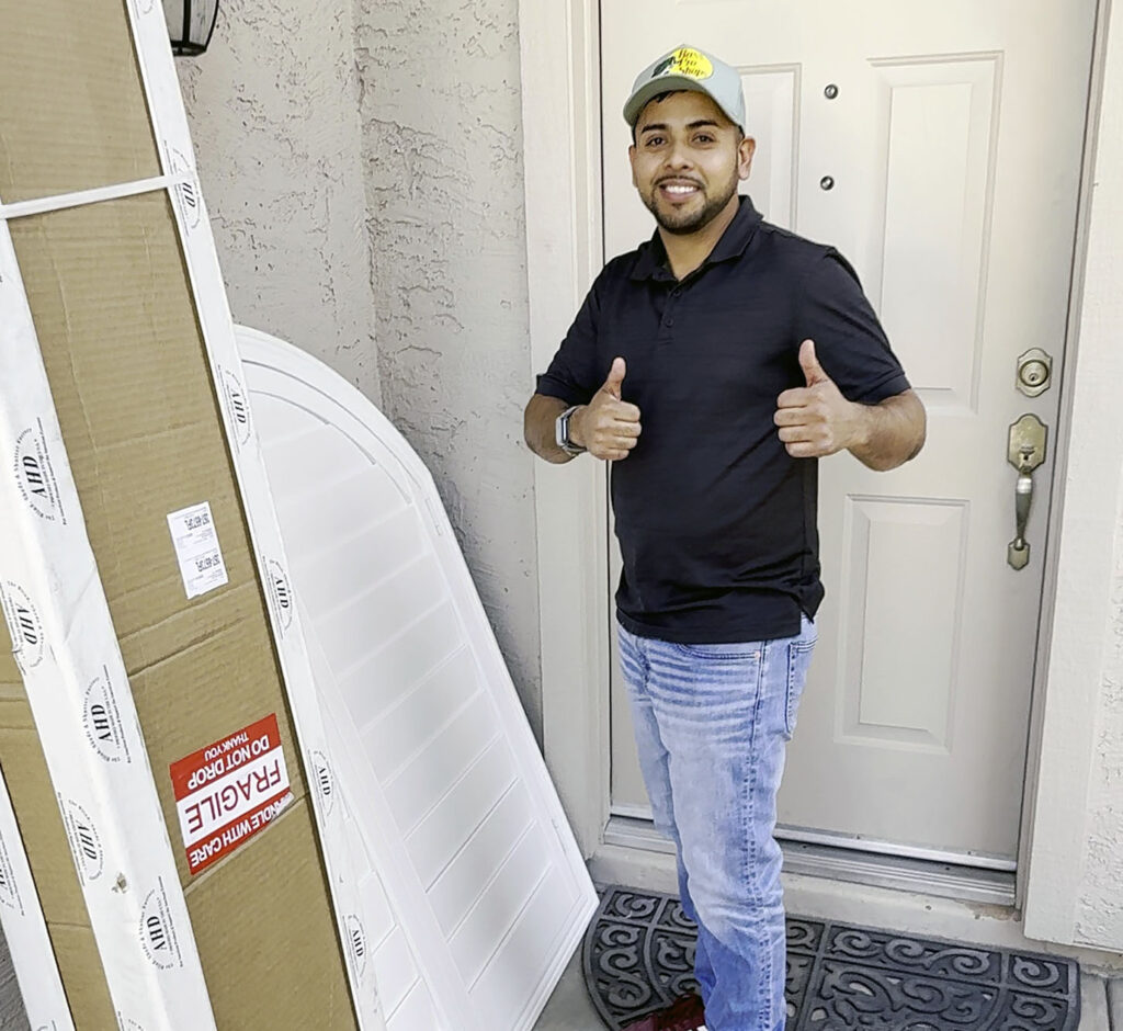 Man delivering shutters to home